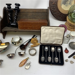 A group of assorted collectables, to include a cased set of silver teaspoons, hallmarked Cooper Brothers & Sons Ltd Sheffield 1925, a silver napkin ring, hallmarked James Swann, Birmingham 1904, a cheese knife with silver handle, hallmarked Harrison Brothers (probably), Sheffield 1946, a clear glass scent bottle, small ruby glass scent bottle, and a further later example, a Caithness glass paperweight, green glass buoy, Royal Crown Derby miniature cup, Helena Wolfsohn miniature cup and saucer, assorted silver plate including a large ladle with engraved monogram to terminal, snuff box with suspension ring, assorted clay and wooden pipes, carved wooden frame, wooden desk book stand, etc.