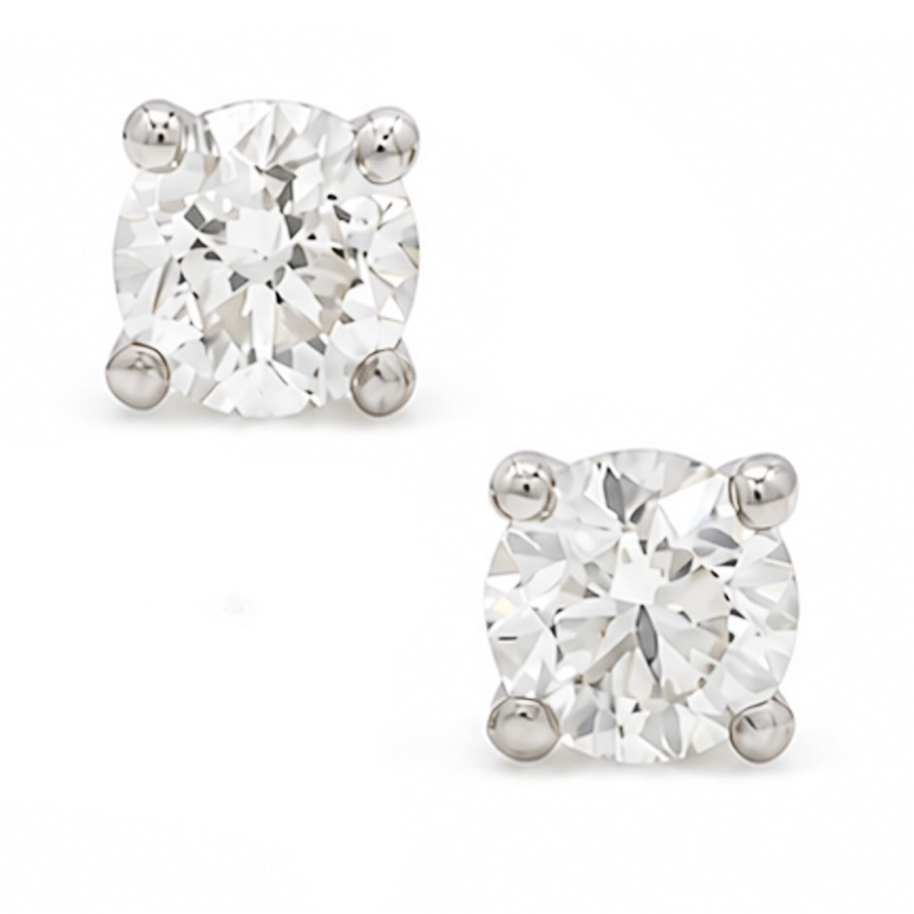 Pair of platinum diamond earrings, each stud set with a single round brilliant cut diamond, stamped PT 950total diamond weight approx 1.05 carat