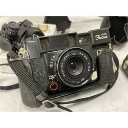 Quantity of cameras and accessories to include Olympus Trip 35, Minolta A f-EII 35mm, Yashica Auto Focus camera, Hanimex 35mm af camera in case, Kodak No.2A Folding Pocket Brownie camera in case, Minolta VLT-501 lens, etc