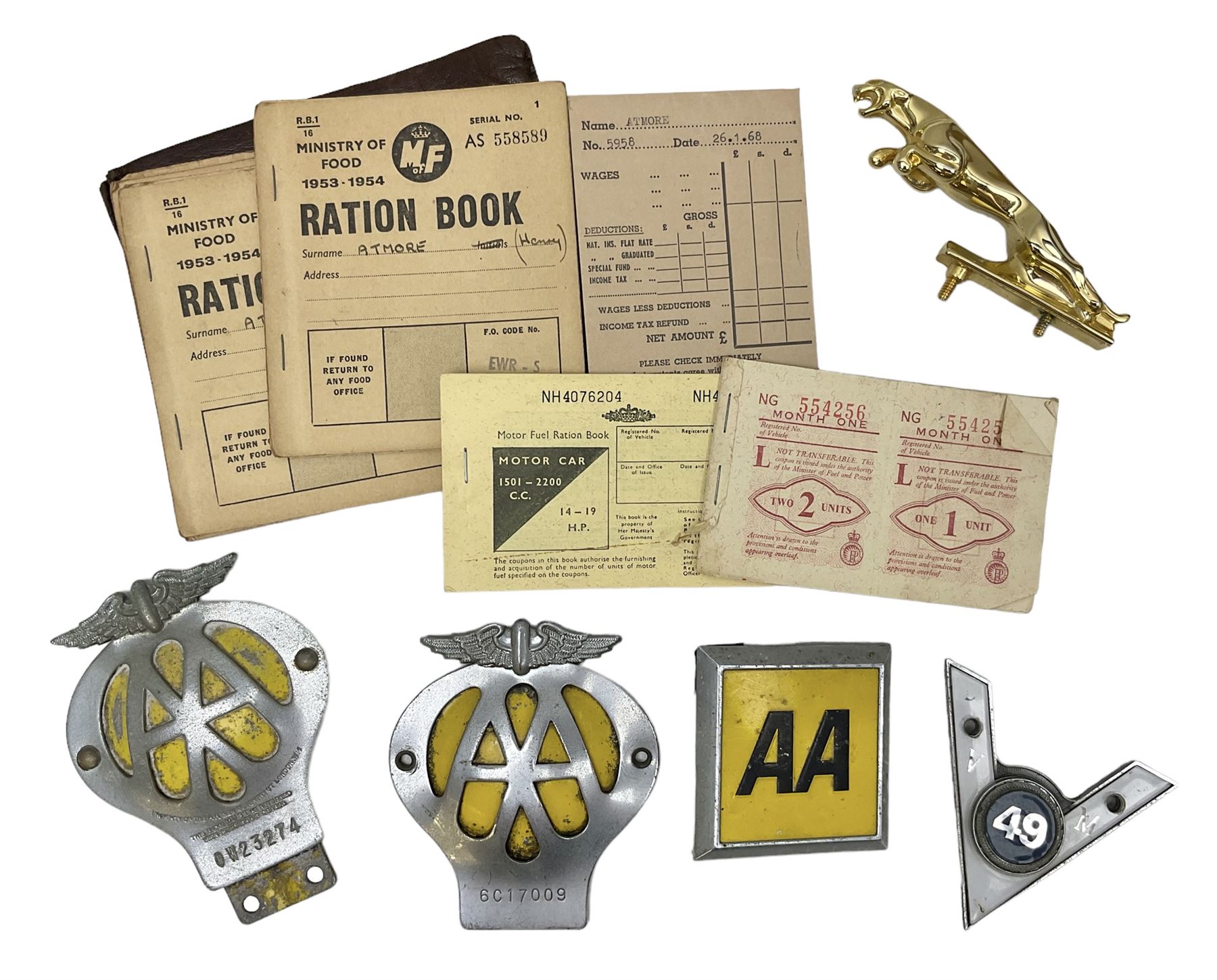 Gold plated leaping Jaguar car mascot, no.7'24265'3WB L12.5cm; three AA car badges and Veteran Motorists car badge; and quantity of 1950s fuel and general ration books