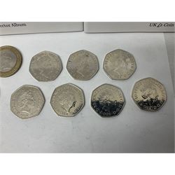 The Royal Mint United Kingdom mostly commemorative two pound, old round one pound and fifty pence coins, overall face value approximately 110 GBP, housed in three 'Coin Hunt' folders and loose