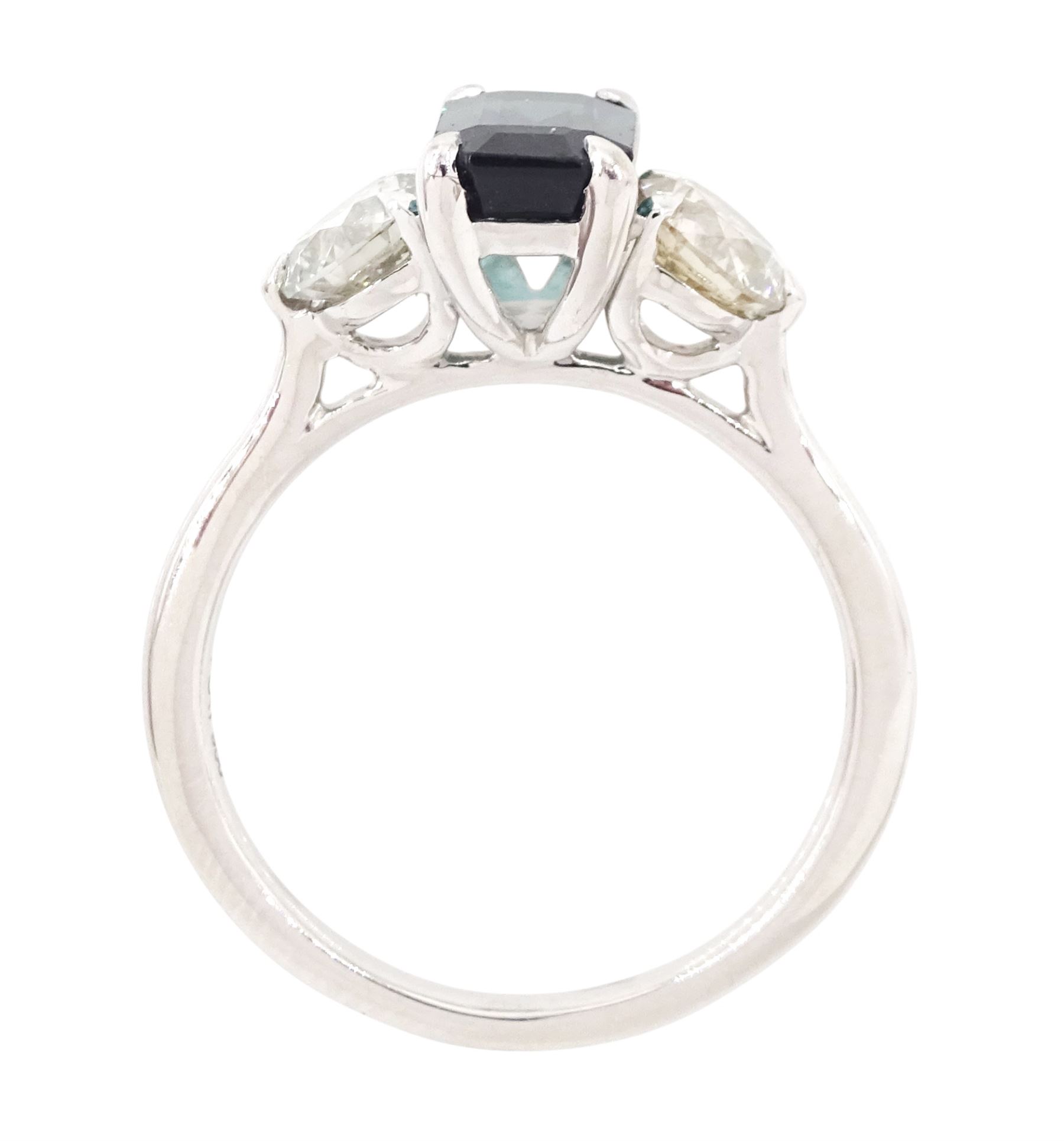 Platinum green tourmaline and diamond three stone ring, single octagonal cut tourmaline of 1.54 carat, with a single round brilliant cut diamond set either side, stamped Plat 950, total diamond weight 1.06 carat