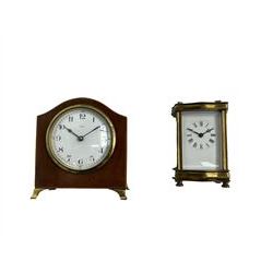French dauphin cased timepiece carriage clock with a replacement lever platform escapement, enamel dial with Roman numerals and minute markers, steel fleur de Lis hands. With an early 20th century mantle clock in a mahogany case,  French timepiece movement with a lever platform escapement.