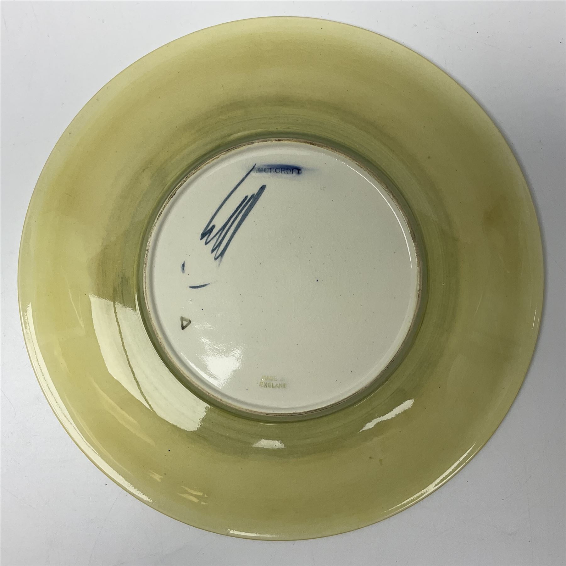 Moorcroft Tiger Lily pattern plate on a yellow ground, with painted and impressed mark beneath, D26cm