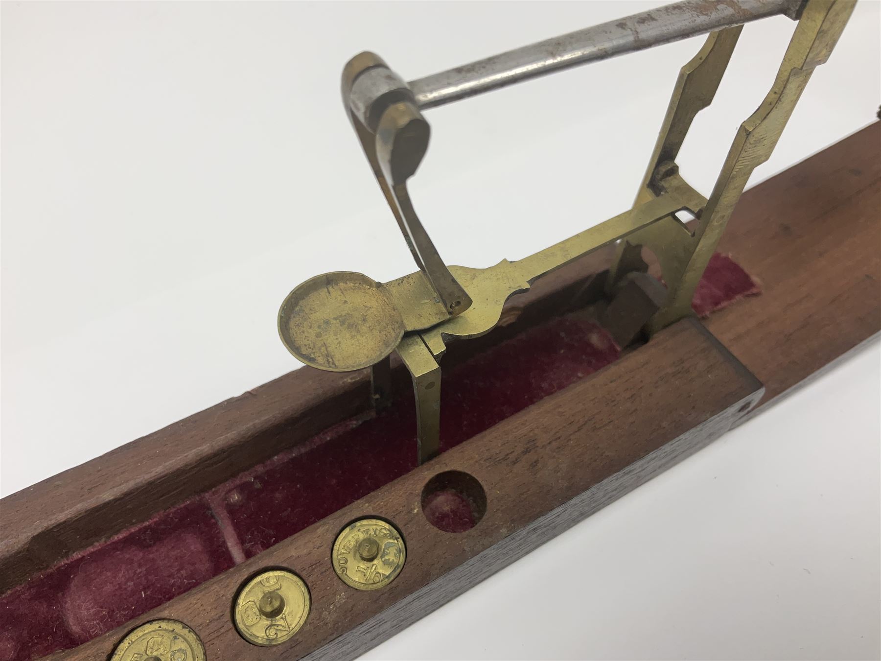 Brass sovereign scales and a part set of Georgian folding sovereign scales (one weight missing)