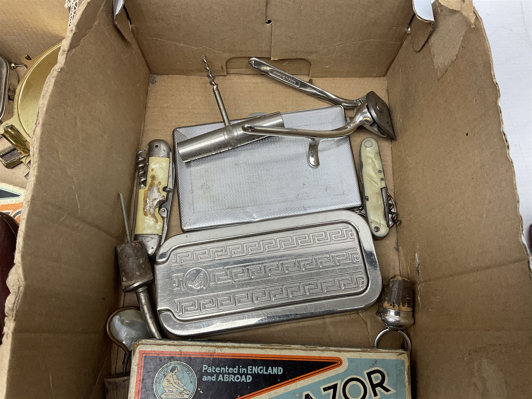 Collection of various razors and smoking items to include Ronson brass table lighter, Rolls Razor, Seigneur case with lighter, etc