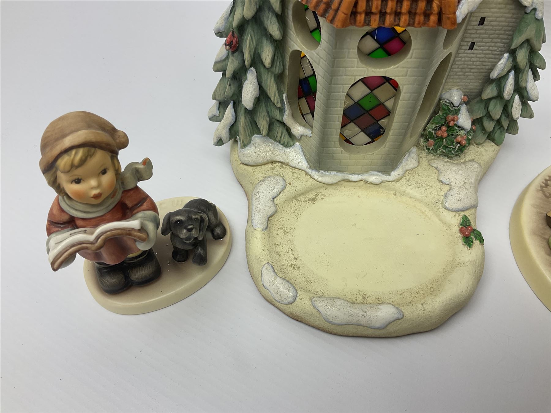 Eight Christmas Hummel figures by Goebel, to include Wintertime Chapel candle holder, Winter Fun, Christmas Morning, Christmas Time and Gingerbread Lane, tallest H21cm