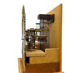 A bespoke handmade 20th century longcase clock in a slim Yew wood case with a German three train weight driven movement sounding the hours and quarters on 12 gong rods, with a brass break-arch dial, cast brass spandrels and an etched chapter ring, Roman numerals and minute track, dial engraved 'Parkinson Liner',  convex boss to the arch engraved 'Tempus Fugit', strike silent facility, With triple weights & Pendulum. 


