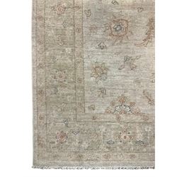 Persian Zeigler rug, ivory ground and decorated with stylised plant motifs, floral design border