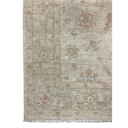 Persian Zeigler rug, ivory ground and decorated with stylised plant motifs, floral design border