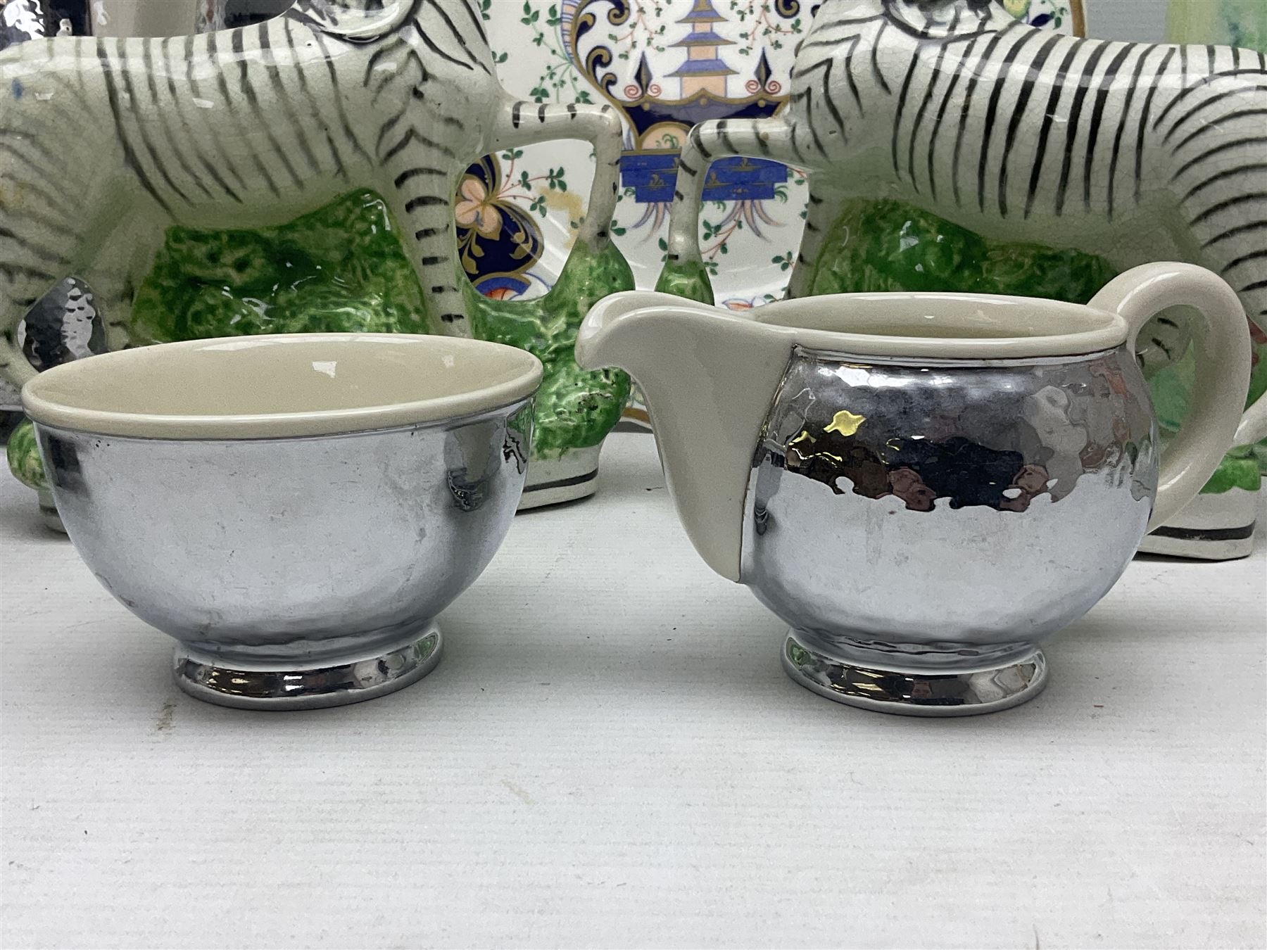 Stayhot teapot and coffee pot, with silver plate clad ceramic bodies, together with another similar coffee pot, jug and sucrier, Staffordshire style flatback figures comprising pair of zebras and cavalier type figure, Melba Ware woodland jug etc