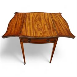 Goergian small butterfly pembroke table, the rectangular top with crossbanded edge and rounded drop leaves, single frieze drawer with opposing dummy drawer, raised on square tapering legs with stringing, terminating in brass castors