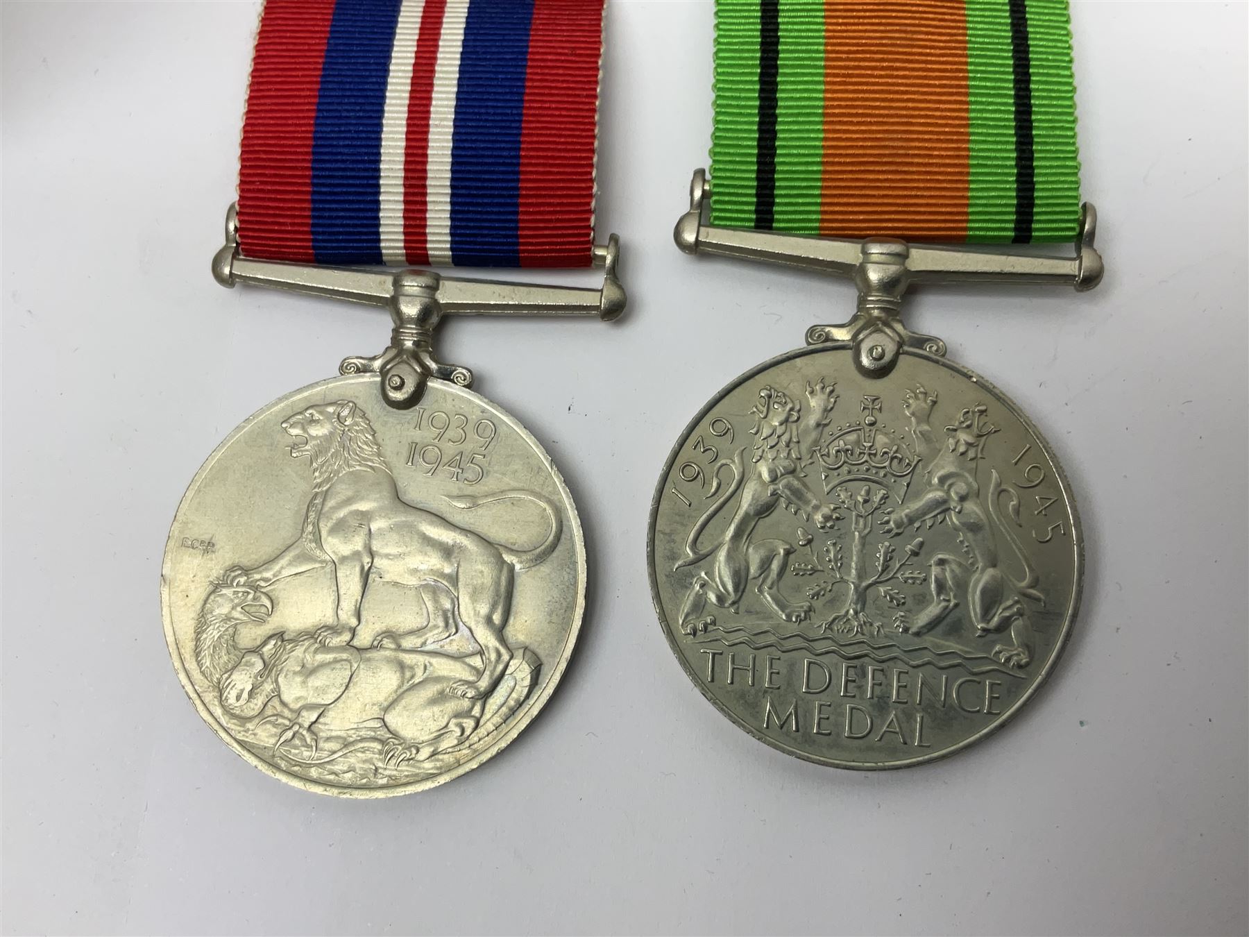 WWI pair of medals comprising British War Medal and Victory Medal awarded to 380807 Pte. W. Hayles Hamps. R.; Imperial Service Medal awarded to William Hayles; cased and boxed; WWII 1939-1945 War Medal and Defence Medal in issue box with slip; 1930s hallmarked silver football presentation fob etc