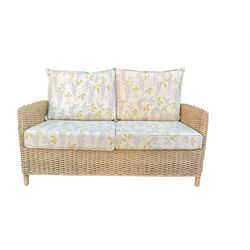 Three piece conservatory suite - cane two seat sofa and pair matching armchairs upholstered in Laura Ashley fabric