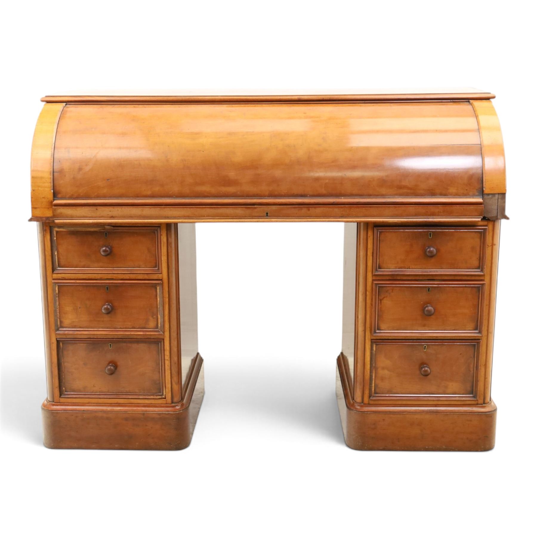 Victorian mahogany twin pedestal cylinder desk, with roll top with fitted interior and with leather writing slide, raised on pedestals with three graduating drawers, raised on a plinth base with castors