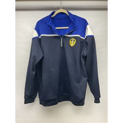 Fourteen items of replica sporting clothing including Leeds United football club shirts, England jerseys etc
