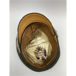 WW2 German Army Artillery officer's peaked cap, red piping to the crown and bordering the central band, zinc eagle and aluminium cockade insignia, officer's bullion chin cords, interior retains original sweatband and lining has tailor's celluloid diamond with 'Extra Klasse' logo and 'Marke Standard'