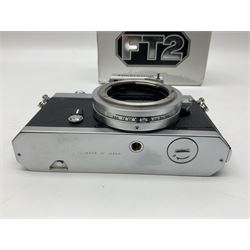 Nikkormat FT2 camera body, serial no. 5066813, in original packaging, together with Nikkormat EL camera body, serial no. 5577358, with Nikon Nikkor 50mm 1:1.8' lens no. 2143575, Nikkormat FT, serial no. 3968385, and Nikomat FT camera body, serial no. 4015491