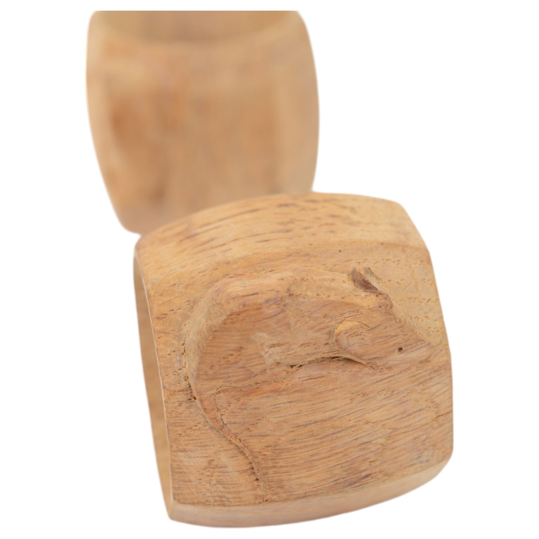 Mouseman - two oak napkin rings, bulbous octagonal form carved with mouse signature, by the workshop of Robert Thompson, Kilburn, H5cm