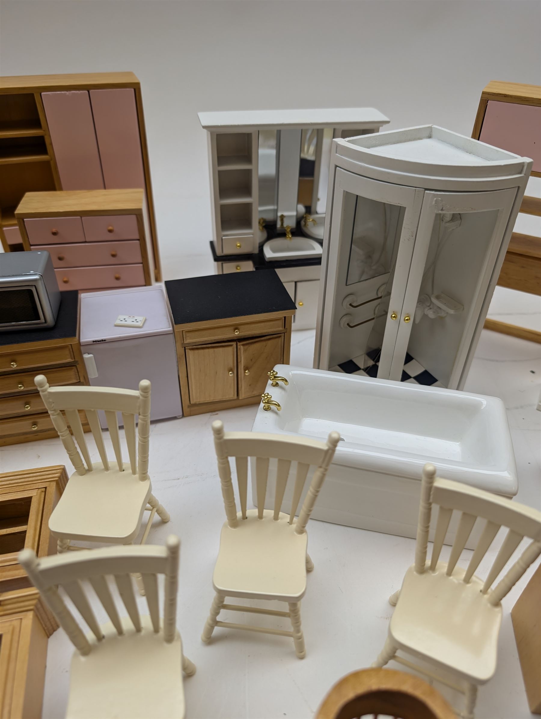Modern 1:12 scale dolls house furniture, comprising pine kitchen set, with wall cabinets, floor cabinets and sink unit, white wooden bathroom suite, white wooden kitchen and dining room furniture and appliances, wooden bedroom furniture, Raine purple wingback chair, tv, desk, fish tank, etc