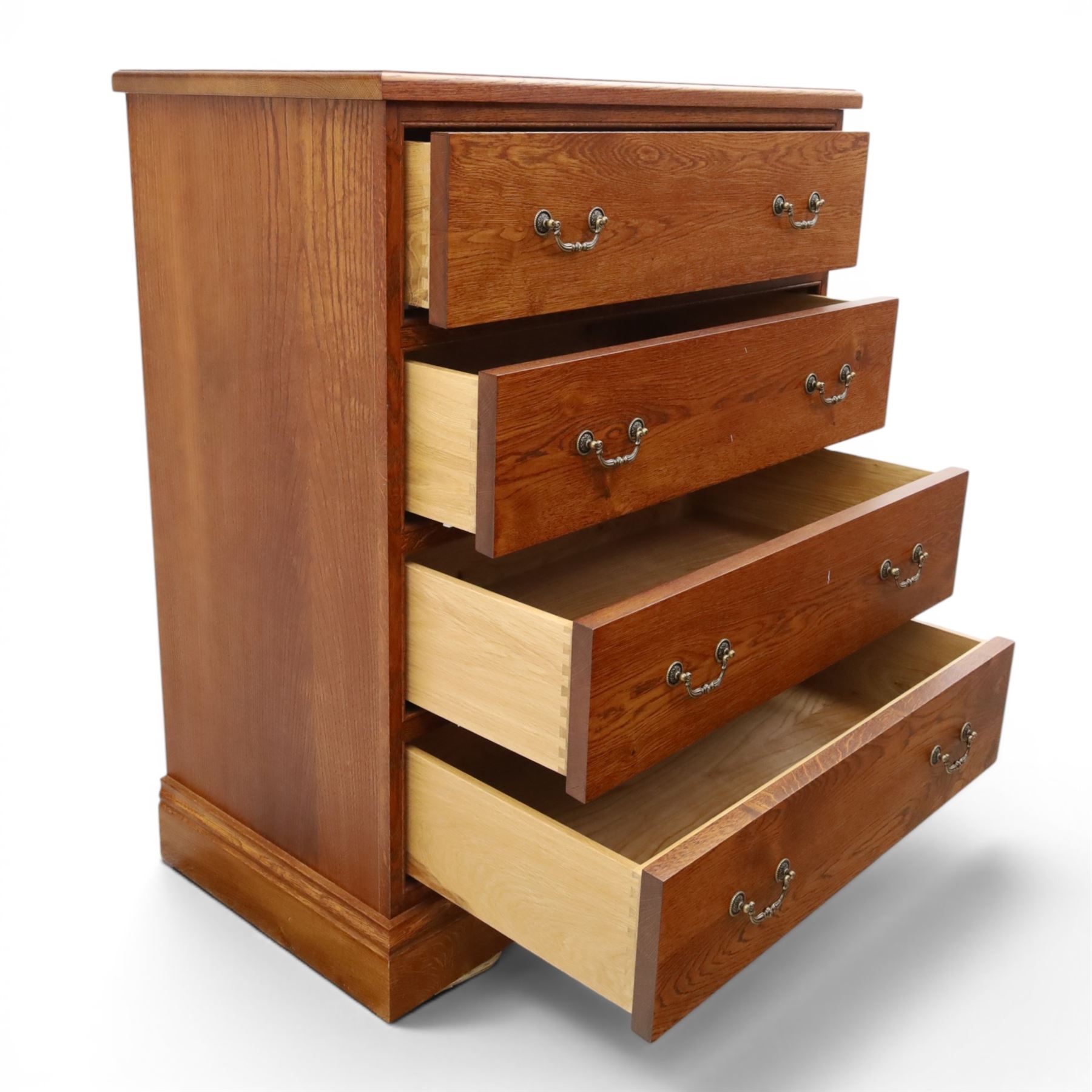 Cabinet-made oak chest, fitted with four soft-close drawers, brass swan neck handles and pierced backplates, on bracket feet