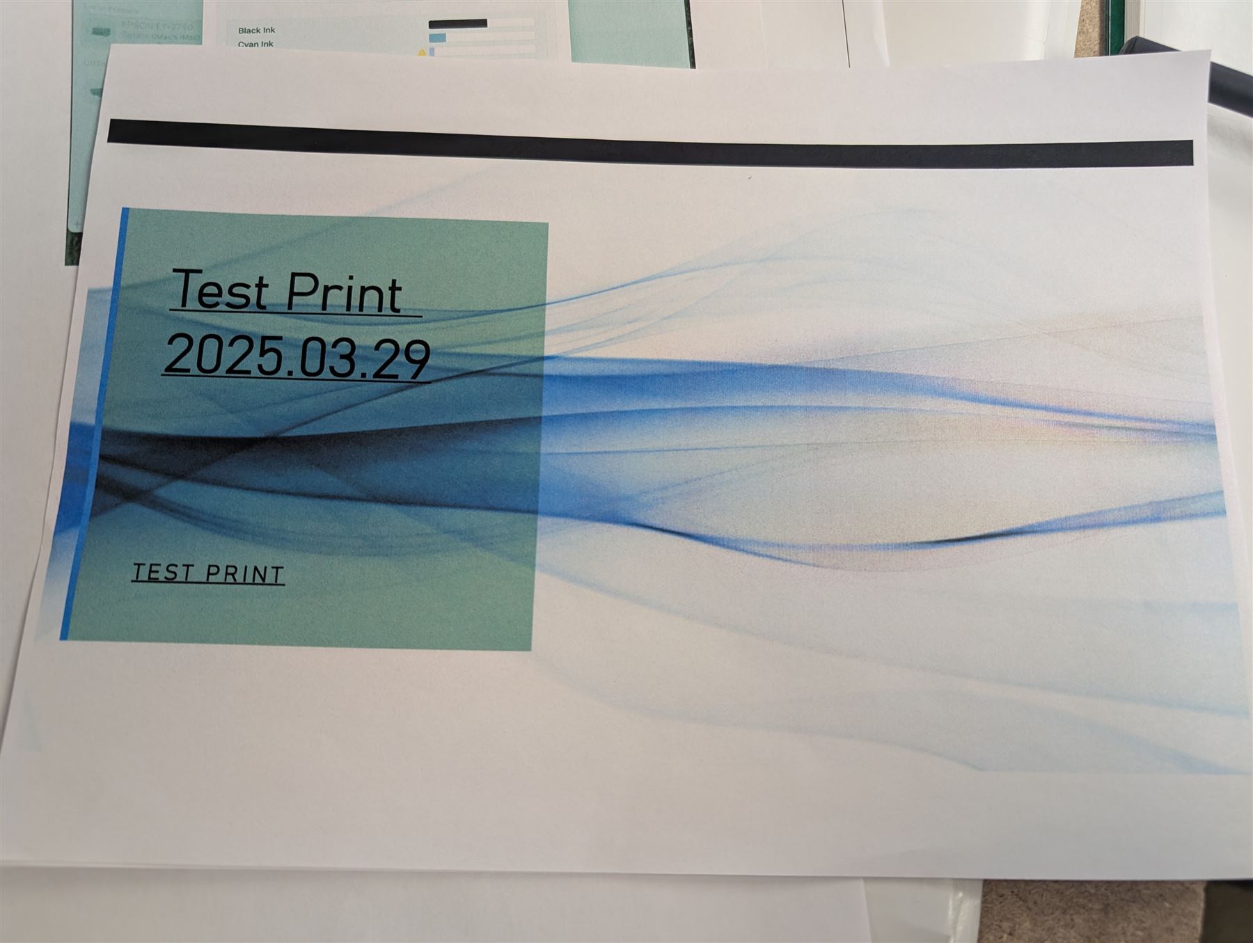 Epson ET-2750 ecotank printer, boxed with a collection of printing paper including photographic paper and postcards