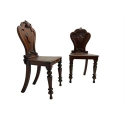 Pair of Victorian mahogany hall chairs, shaped moulded back carved with cartouche, moulded seat on turned front supports