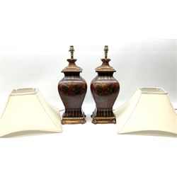 Pair Oriental table lamps decorated with birds in a tree with fruit, on a red ground with a gilded base together with cream lampshades H57cm, without lampshade. 