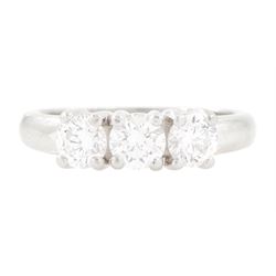 Platinum diamond three stone ring, each four claw set with a round brilliant cut diamond, ...