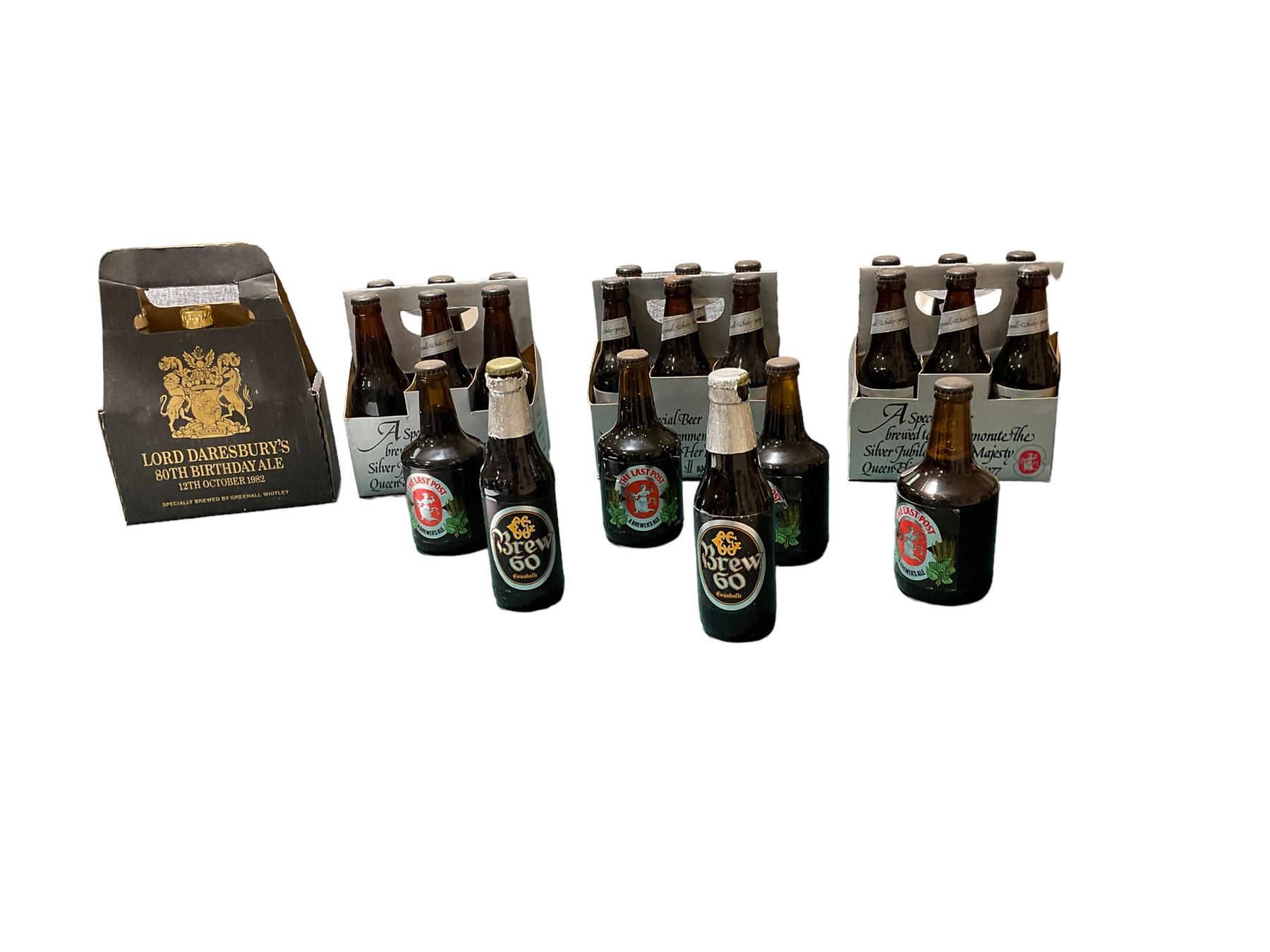 Collection of bottled beers from Greenall Whitley Brewery, including Jubilee beers, Lord Daresbury's 80th birthday ales and The Last post  