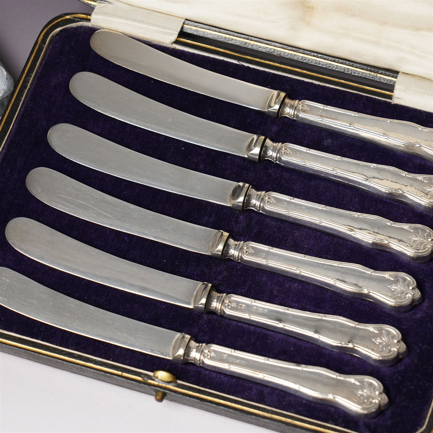 Set of six Australian silver coffee spoons each with a different terminal including Koala, Emu etc, Melbourne mint, cased and a set of six silver handles pastry knives, cased