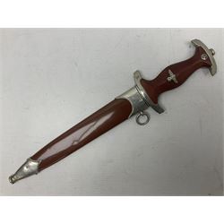WW2 German SA dagger the 22cm double edged steel blade by G. Felix Gloriawerk Solingen inscribed 'Alles Fur Deutschland', the cross-piece impressed with the SA Gruppen mark Nm verso for Nordmark, wooden grip inset with eagle and SA emblem; in brown painted scabbard with nickel mounts L37cm overall