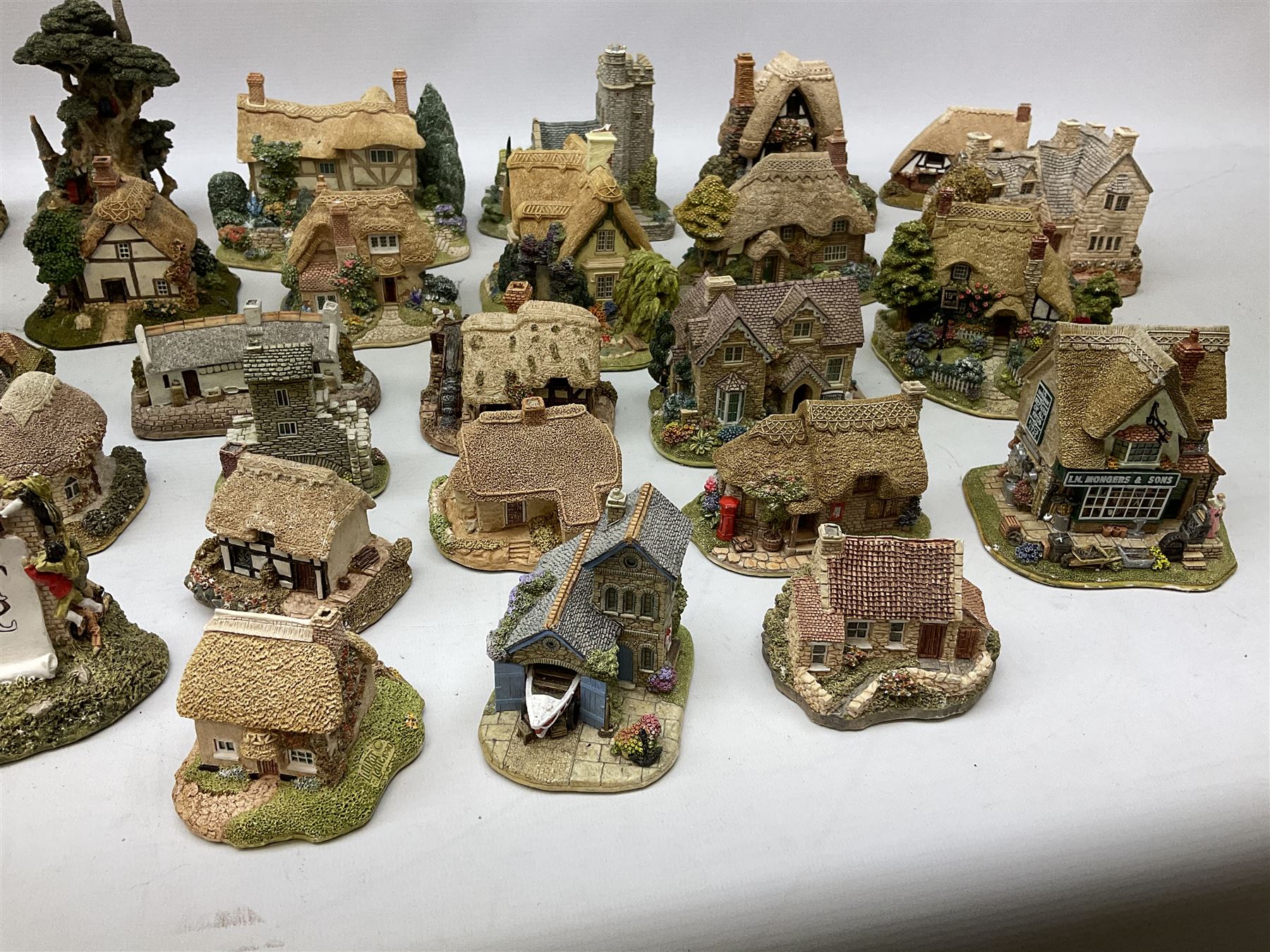 Forty six Lilliput Lane model cottages, to include 'Convent in the Woods', 'Holme Dyke' 'Secret Garden' etc