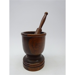  19th century turned lignum vitae pestle & mortar, turned goblet shaped mortar on circular base, turned tapering pestle, H18cm pestle L24cm   