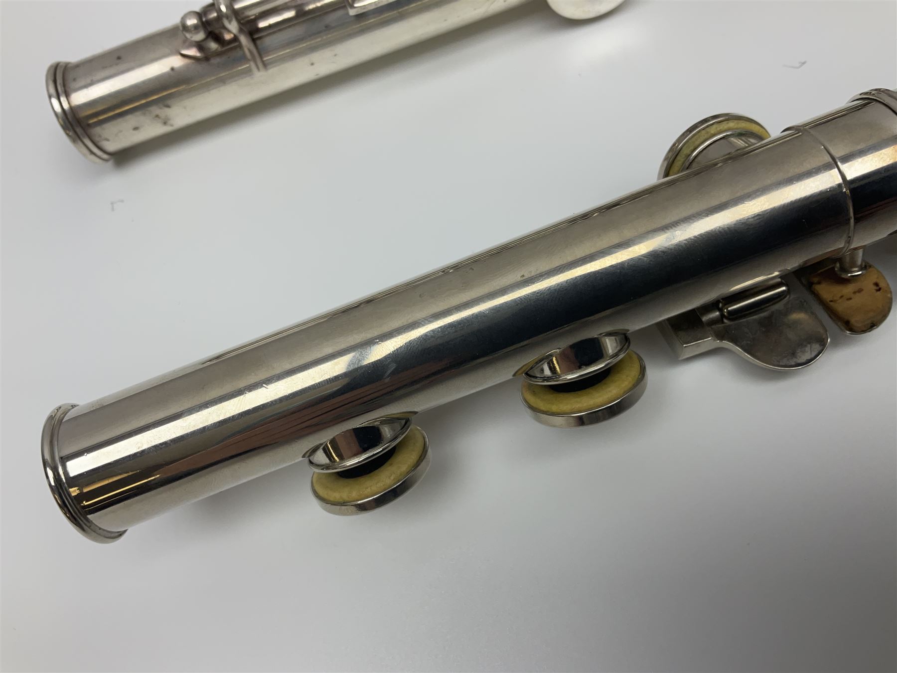 Boosey & Hawkes London Regent three-piece flute, serial no.345447; in B&H Bandhite hard carrying case; and Deg Music Company Inc. USA Claudel Model three-piece flute, serial no.491718, in hard carrying case (2)