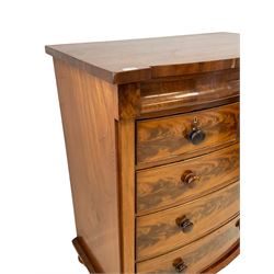 Late 19th century mahogany bow-front chest, fitted with banded cushion drawer with secret catch, above two short over three long graduating drawers, each cock-beaded with turned handles, lower moulded edge over turned feet