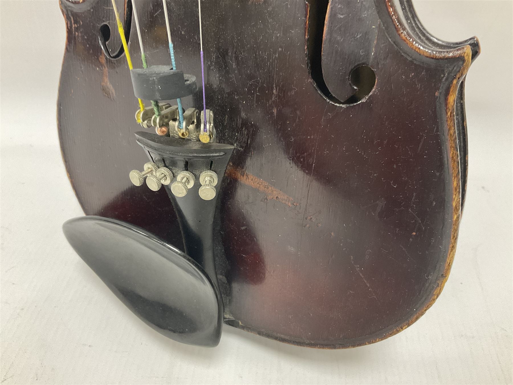 Neuner & Hornstiner early 20th century half size violin c1900, two piece maple back and ribs with a spruce top in a later ridged carrying case, no bow Length 57cm