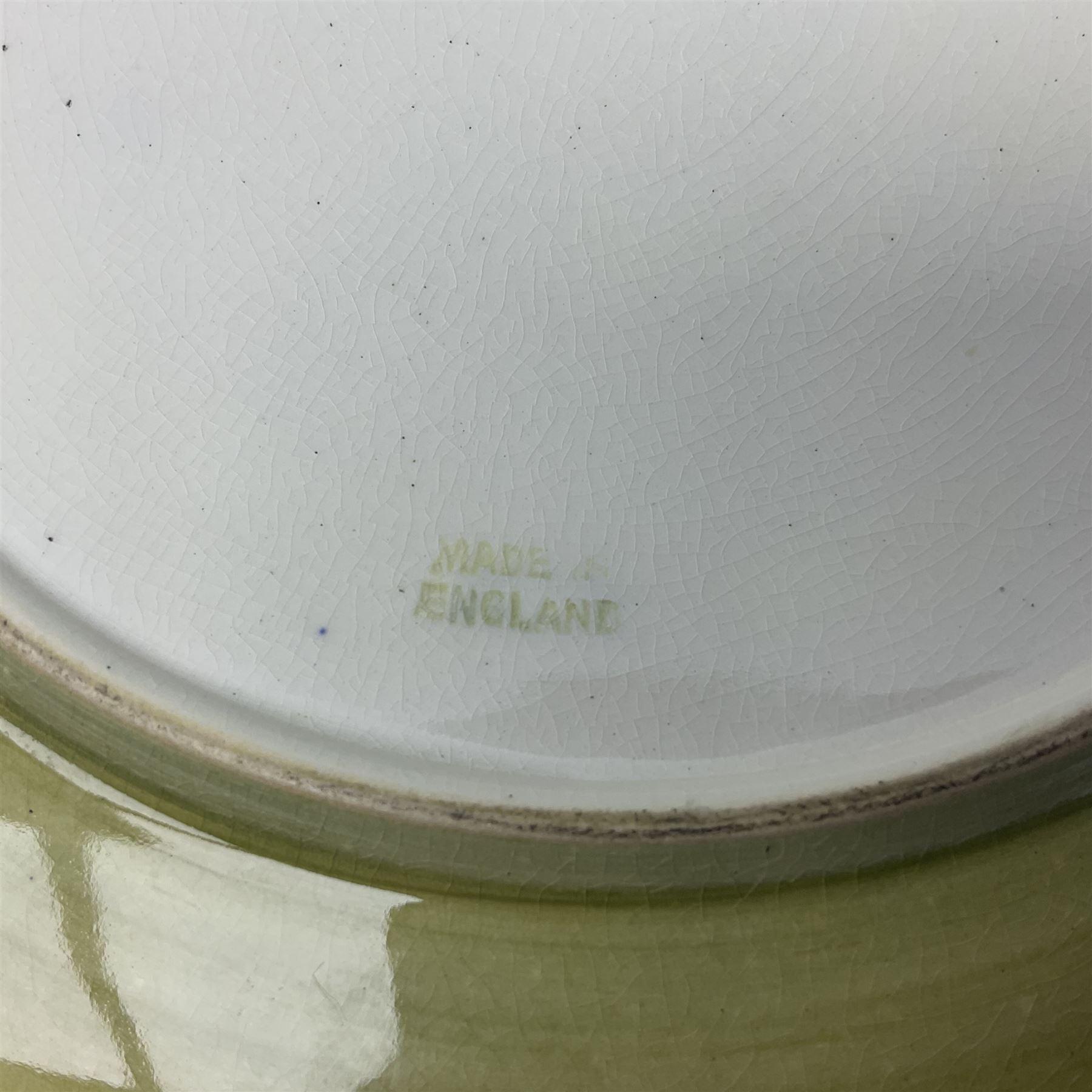 Moorcroft Tiger Lily pattern plate on a yellow ground, with painted and impressed mark beneath, D26cm