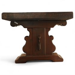 Early 20th century French oak refectory table, the thick rectangular top with cleated ends above shaped lyre-form trestle supports, united by a central stretcher, on broad scrolled feet, displaying well-figured quarter sawn grain across the top