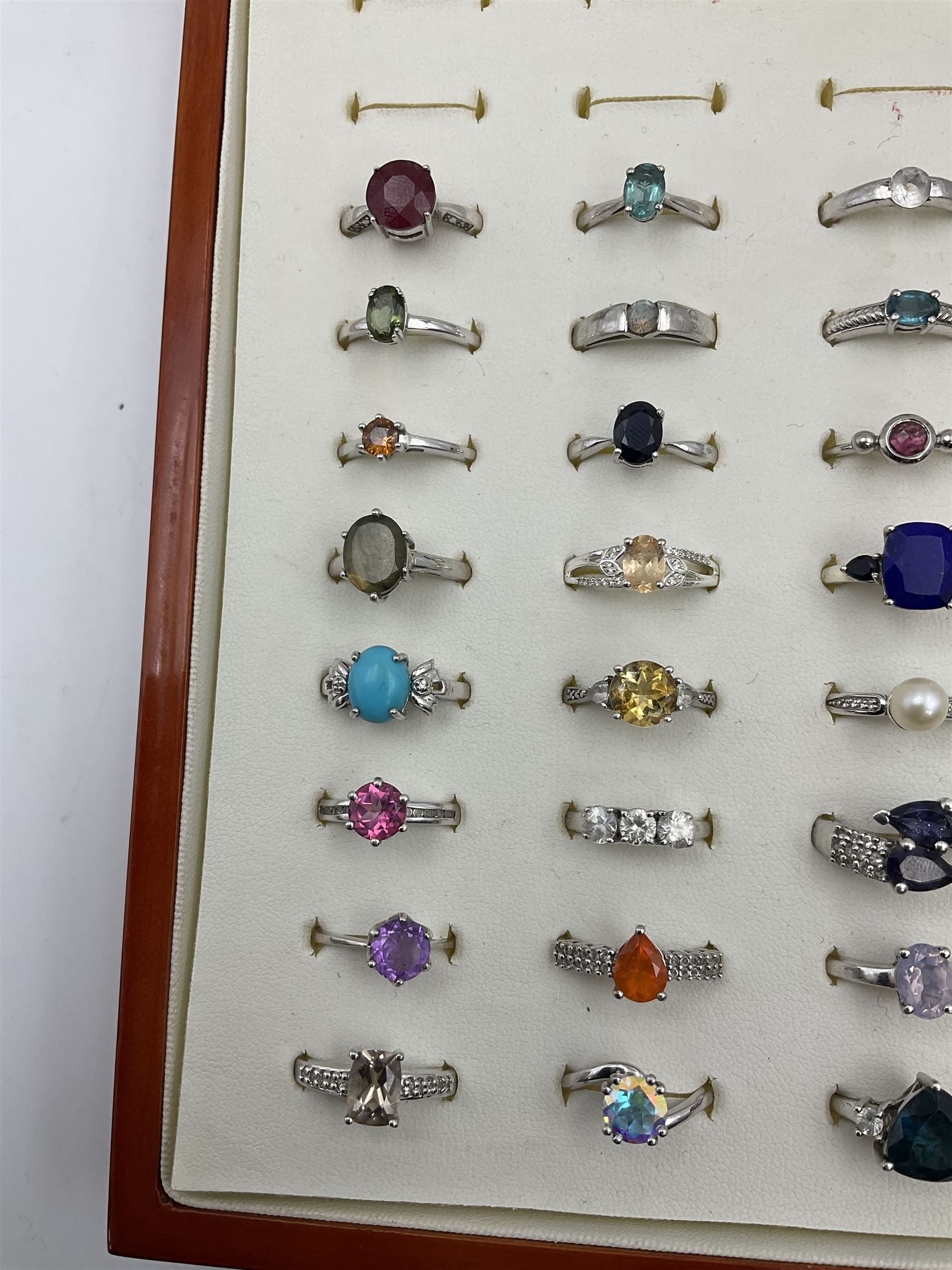 Silver Collector Rings Forty silver stone-set rings, including ruby, topaz, pearl, labradorite ...