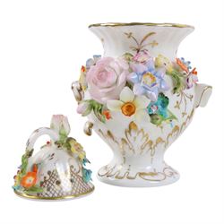 Collection of Coalport items, comprising floral mantel clock, houses including 'Park Lodge' 'The Umbrella House' 'Keepers Cottage', Coalbrookdale floral jar, and others; Kingmaker mouse ornament; Egyptian-style granite Bastet cat ornament, in one box