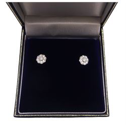 Pair of silver cubic zirconia flower cluster stud earrings, stamped 925 