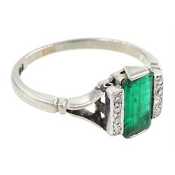 Early 20th century platinum emerald cut emerald and eight stone single cut diamond ring, stamped PT, emerald approx 0.70 carat