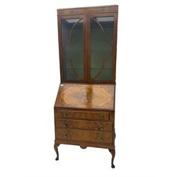 Early 20th century walnut bureau bookcase, two glazed doors over fall front, fitted with three drawers, on shell carved cabriole feet