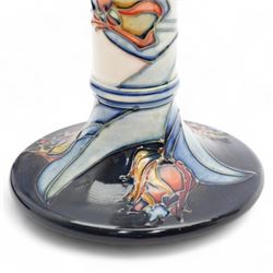 Pair of Moorcroft candlesticks, decorated in the Red Tulip pattern by Sally Tuffin, impressed and painted marks to bases, H21cm (2)