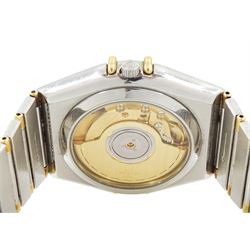 Omega Constellation gentleman's stainless steel and gold automatic chronometer wristwatch, Ref. Cal. 1111, serial No. 49547890, white dial with date aperture and exhibition back case, on integral bracelet No. 1448.5/431, with fold-over clasp