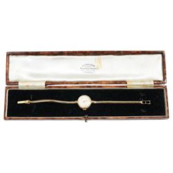9ct gold ladies manual wind Waltham wristwatch, on 9ct gold articulated strap, with P.S Phillips & Co jewellery box 