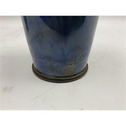 Two Royal Doulton stoneware vases, the first example with tubelined floral decoration, the second with Art Nouveau decoration, together Doulton Lambeth vase of flattened form with foliate decoration on a green ground, all with impressed mark beneath, tallest example H26cm