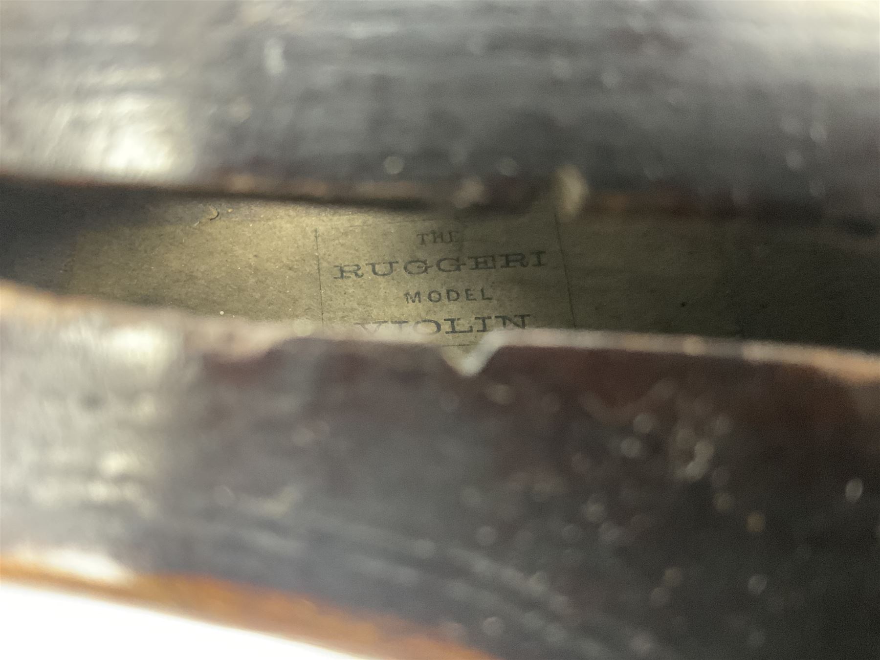 German violin c1890 with 36cm two-piece maple back and ribs and spruce top; bears label 'Antonius Stradivarius Cremona Faciebat Anno 1729' L59.5cm overall; in ebonised wooden 'coffin' case; and two German violins c1890 for completion - one bearing a Stradivarius label, the other a Ruggeri label; both in carrying cases (3)