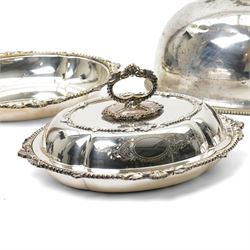 Pair of silver plated oval entree dishes and covers with bead edge and shell moulded borders and engraved covers and matching chafing dish by Martin Hall & Co and a plated meat cover